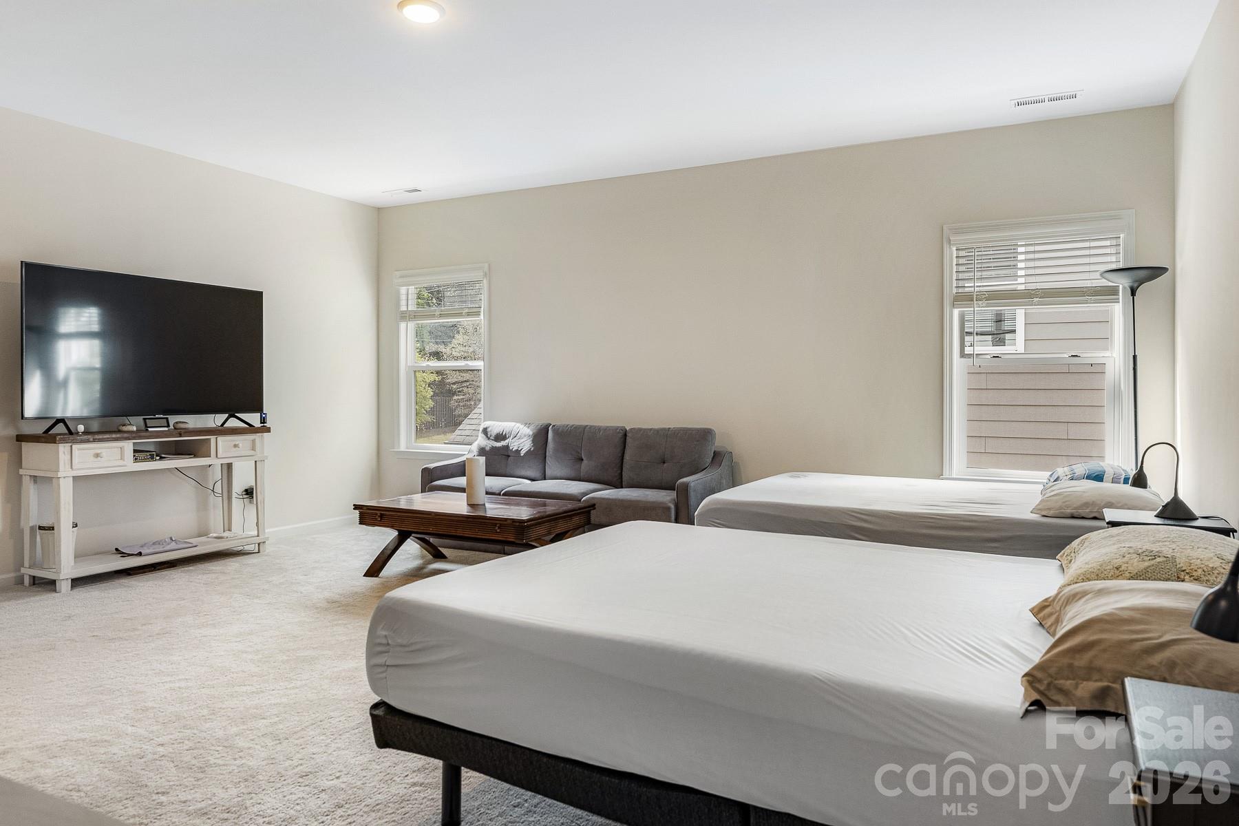 2036 Oliver Terrace Fort Mill, SC 29707 - Photo 29 of 41 a bedroom with two beds and a flat screen tv