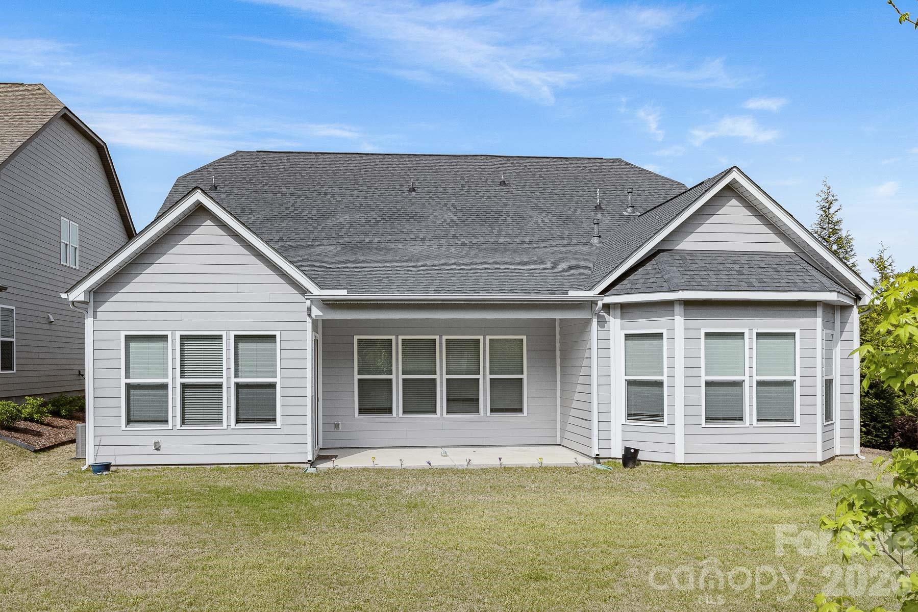 2036 Oliver Terrace Fort Mill, SC 29707 - Photo 38 of 41 a view of a house with a large window and wooden fence