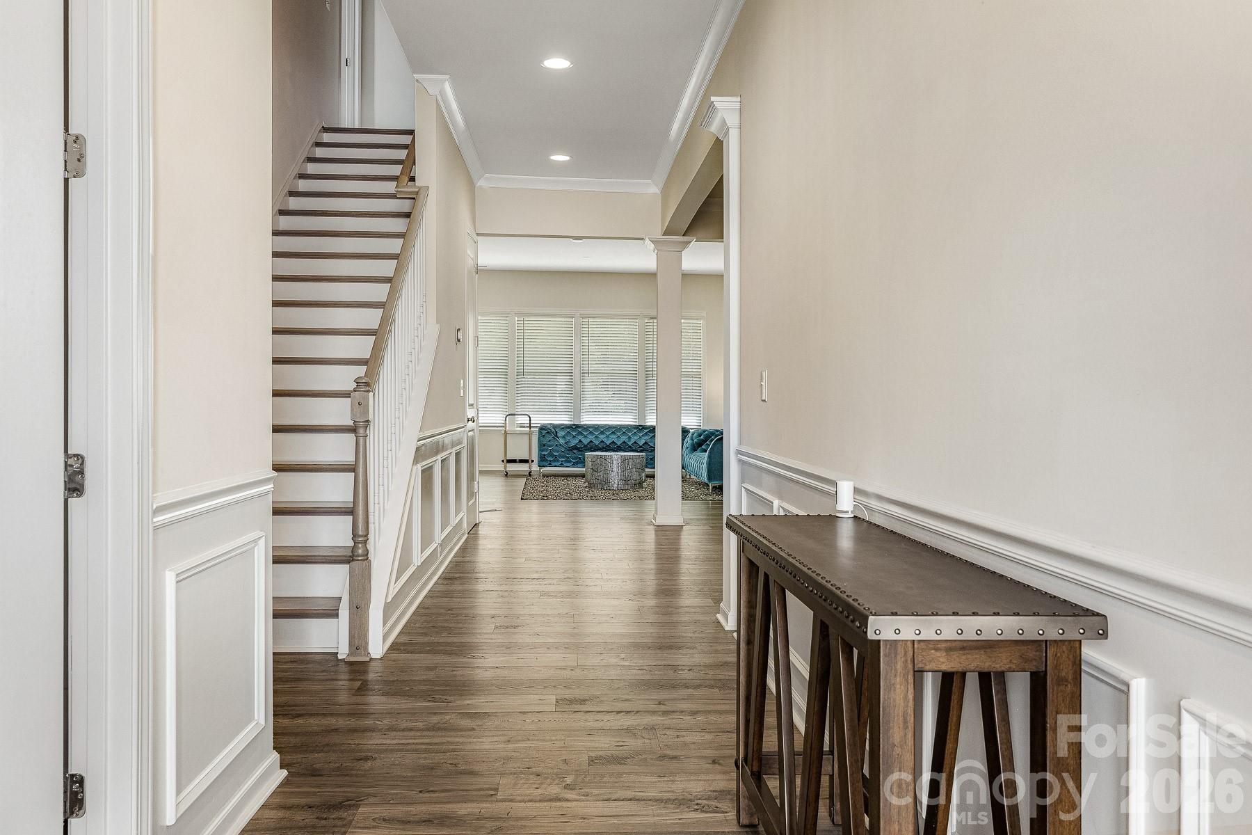 2036 Oliver Terrace Fort Mill, SC 29707 - Photo 4 of 41 a hallway with wooden floor table and chairs