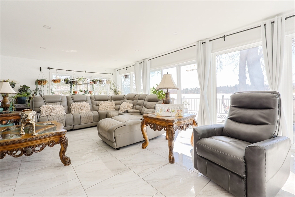 207 White Pond Road Lancaster, MA 01523 - Photo 13 of 38 a living room with furniture and a large window