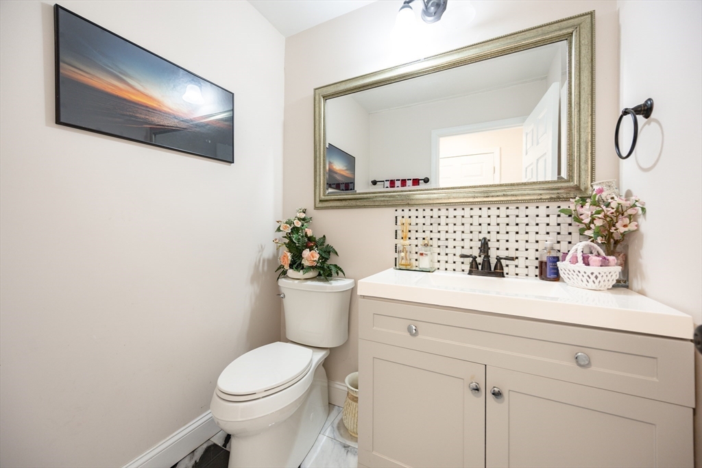 207 White Pond Road Lancaster, MA 01523 - Photo 22 of 38 a bathroom with a toilet sink and mirror