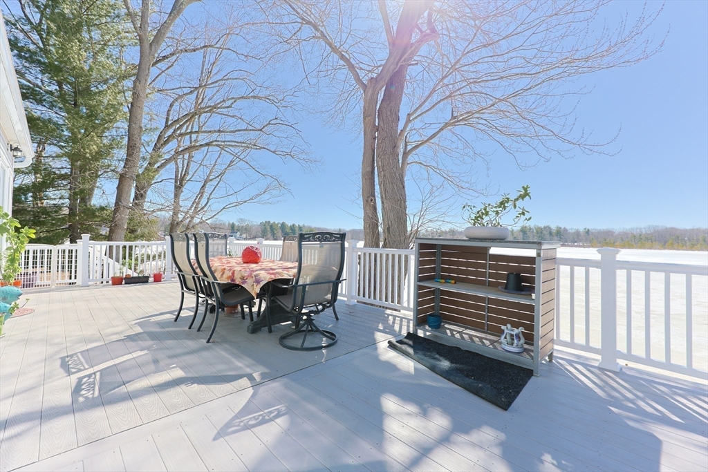 207 White Pond Road Lancaster, MA 01523 - Photo 29 of 38 a view of a patio with a table and chairs