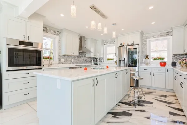 a kitchen with a sink cabinets and window