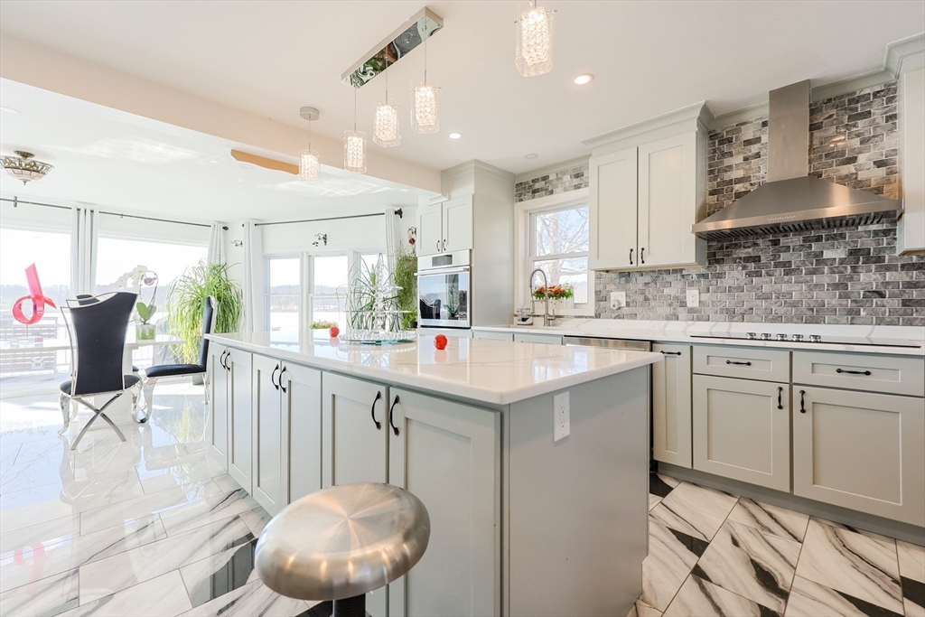 207 White Pond Road Lancaster, MA 01523 - Photo 7 of 38 a kitchen with a sink cabinets and window