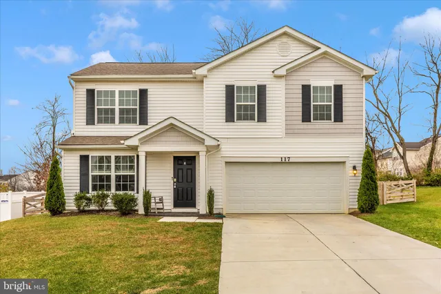 a front view of a house with yard