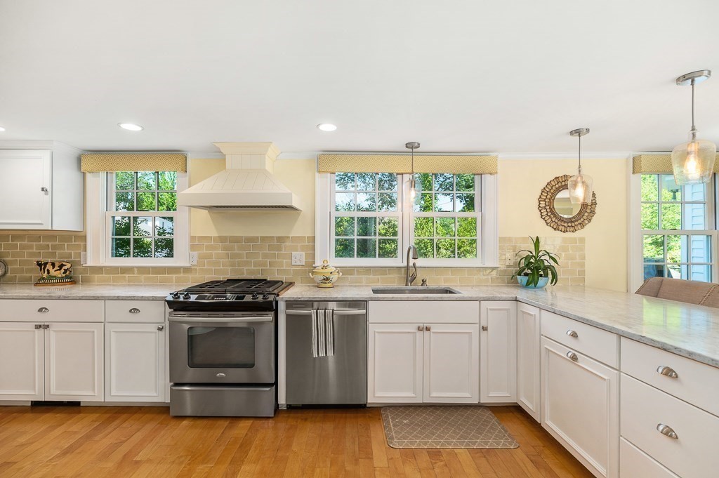 18 Union Street Manchester, MA 01944 - Photo 15 of 35 a kitchen with a sink stove and cabinets