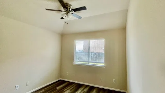 a bathroom with a granite countertop sink toilet a mirror and shower