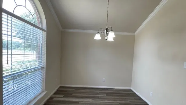 a kitchen with stainless steel appliances granite countertop a sink stove and microwave