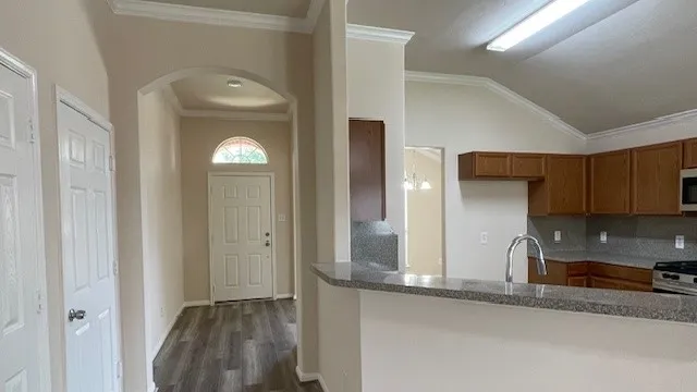 a view of a house with a backyard