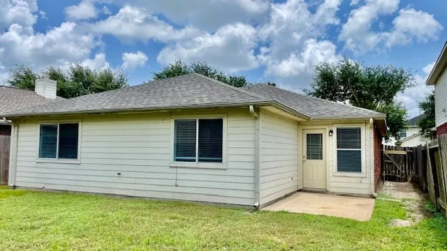 a view of a kitchen with granite countertop a sink and dishwasher