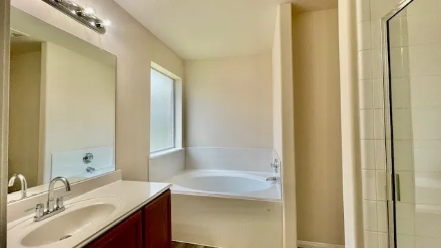 a view of empty room with ceiling fan