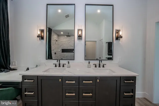 a bathroom with a double vanity sink and a mirror