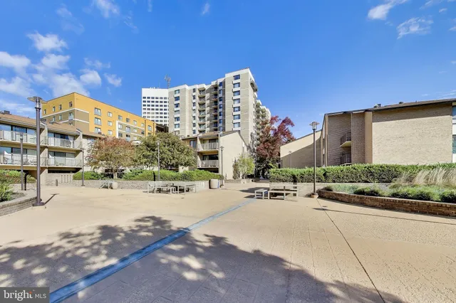 a lobby with furniture and large windows