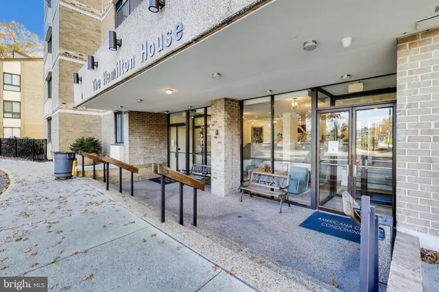 a view of a building with sitting area