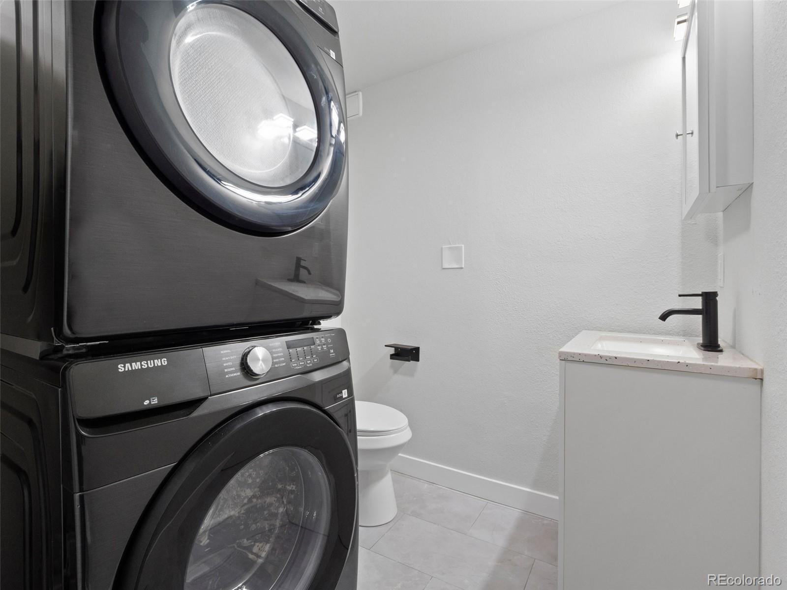 1035 6th Street Berthoud, CO 80513 - Photo 22 of 30 a utility room with dryer and washer