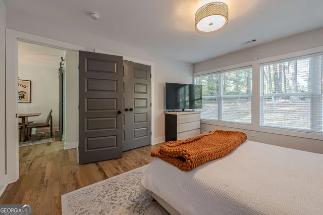 a bedroom with a bed and furniture