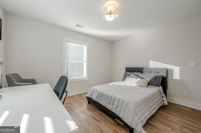 a bedroom with bed and a window