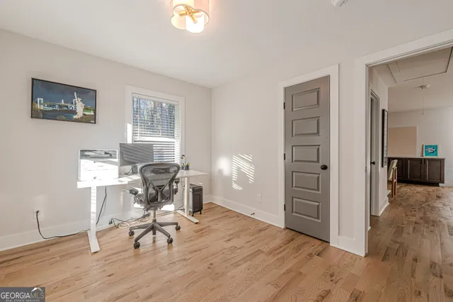 a workspace with furniture and a window