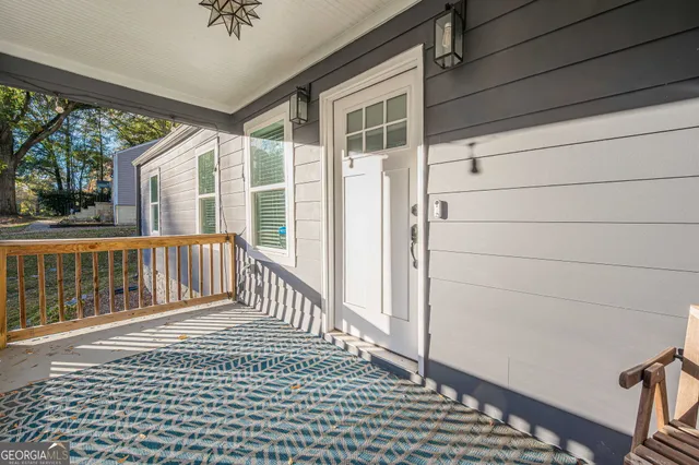 a view of a balcony with wooden floor