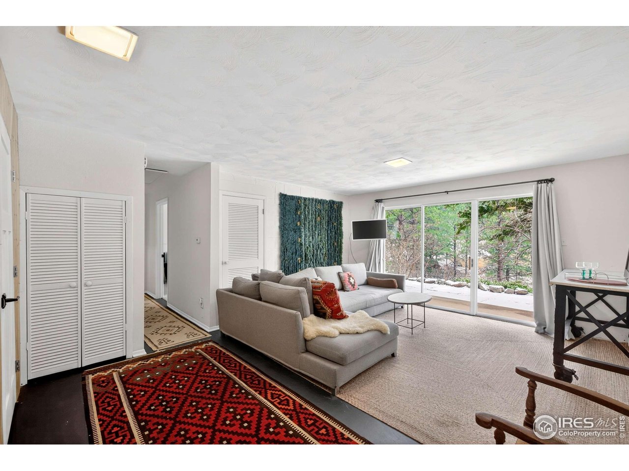 4 Porphyry View Jamestown, CO 80455 - Photo 18 of 34 a living room with furniture and a flat screen tv