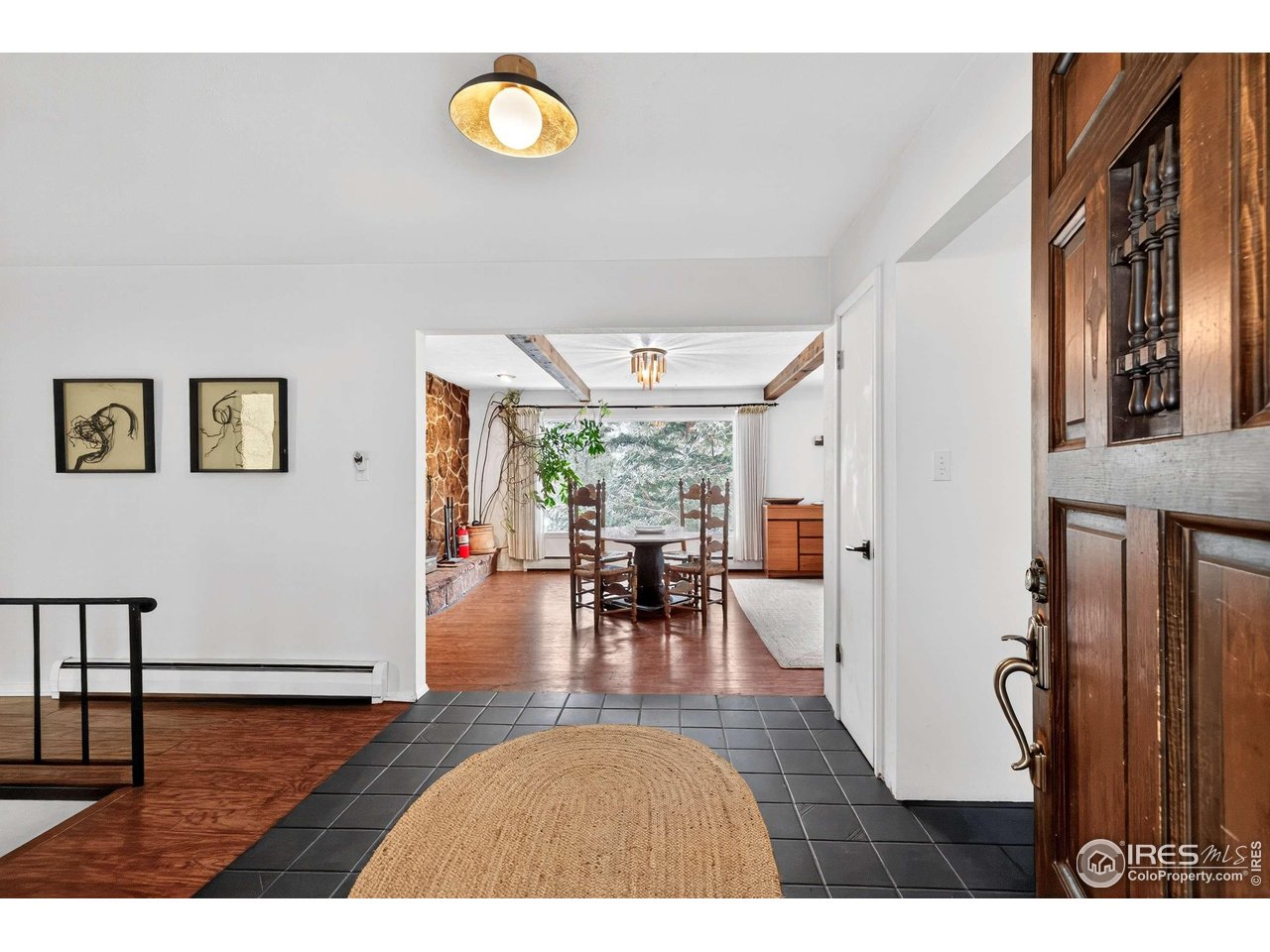 4 Porphyry View Jamestown, CO 80455 - Photo 3 of 34 a view of a dining room with furniture window and wooden floor