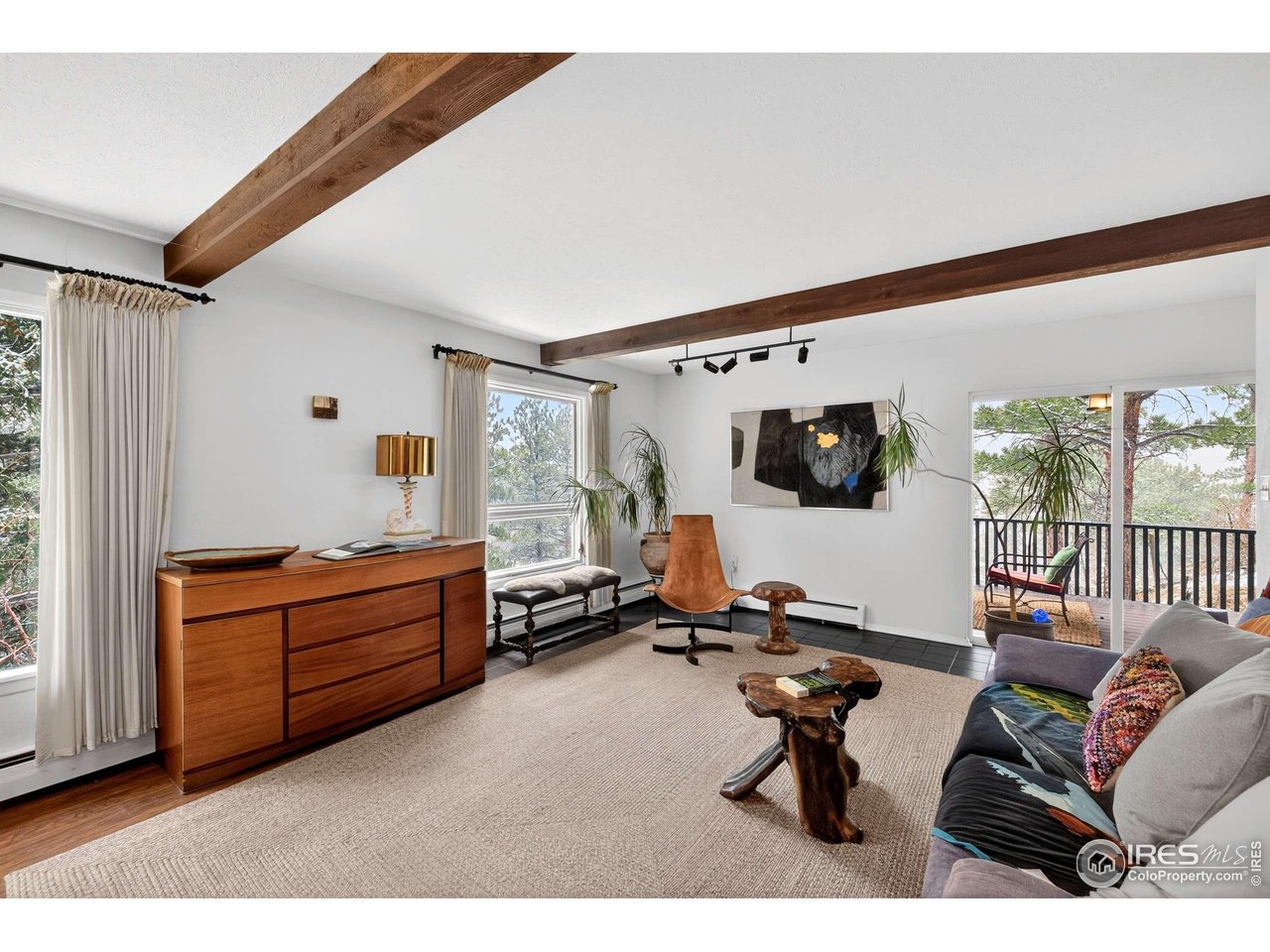4 Porphyry View Jamestown, CO 80455 - Photo 6 of 34 a living room with furniture a flat screen tv and a window
