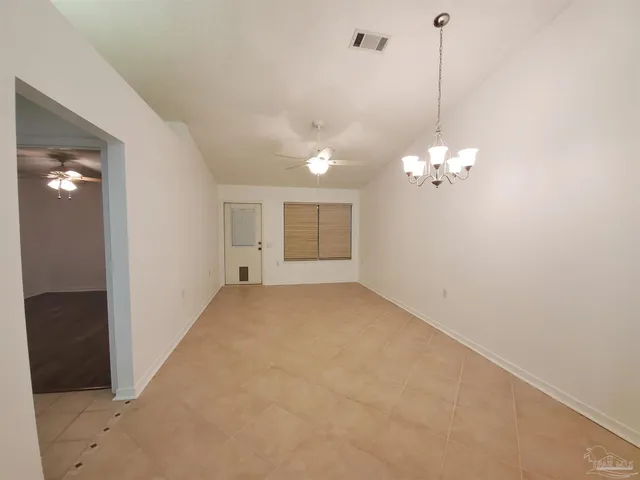 a view of a chandelier in big room and chandelier