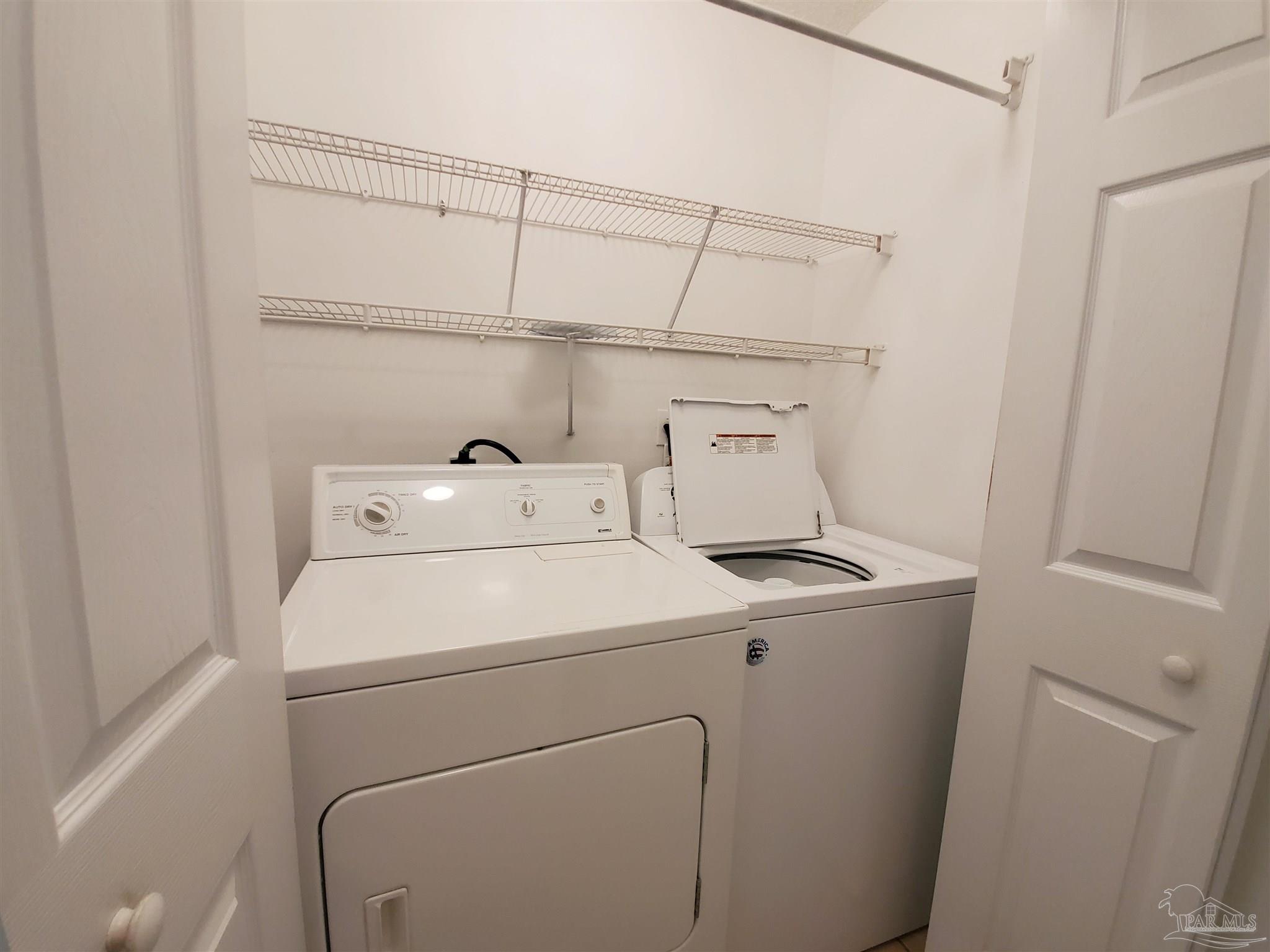2527 Trailwood Drive Cantonment, FL 32533 - Photo 10 of 12 a utility room with dryer and washer