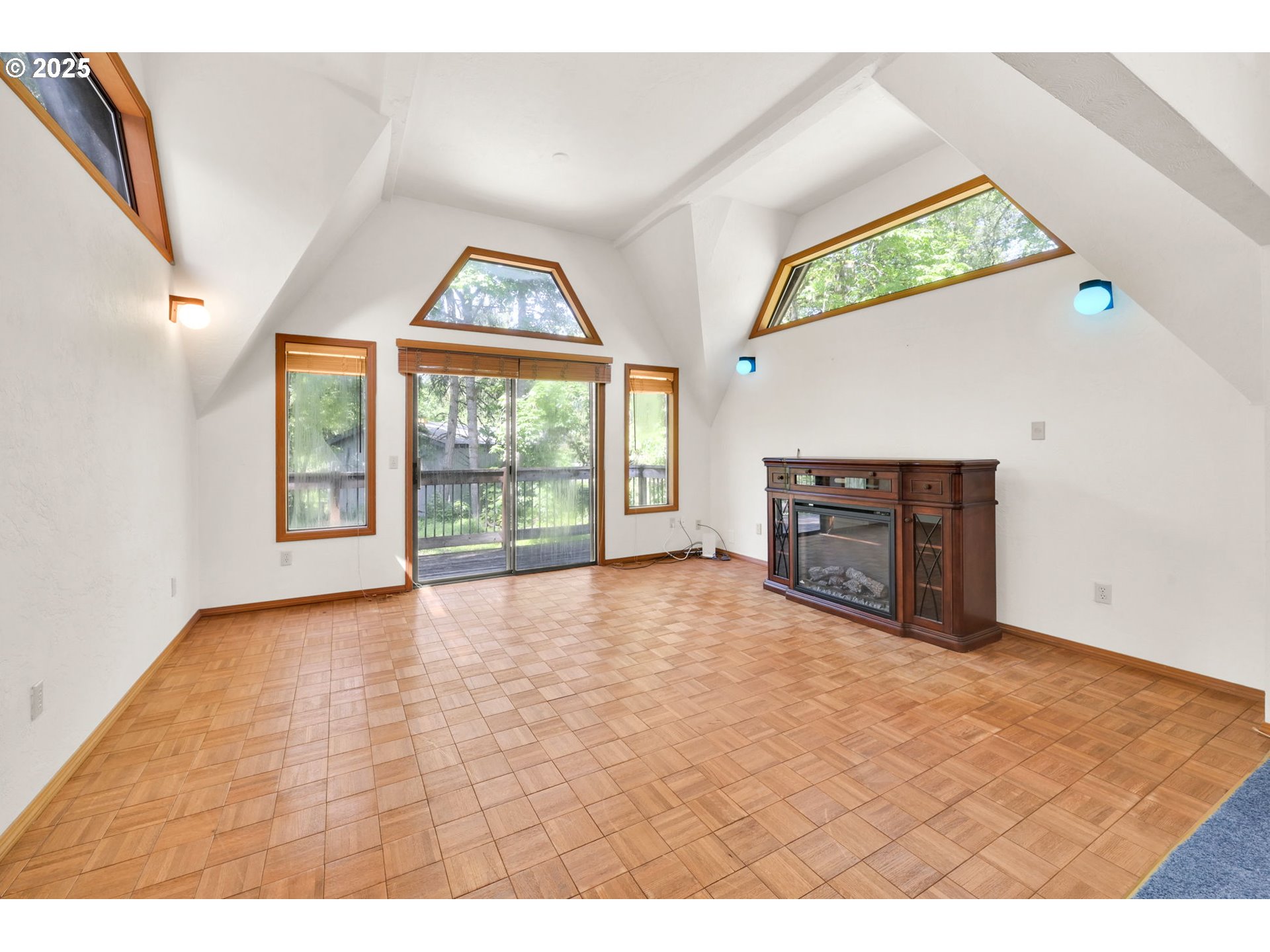 38383 Kickbusch Lane Springfield, OR 97478 - Photo 12 of 44 a view of an empty room with a window and a fireplace