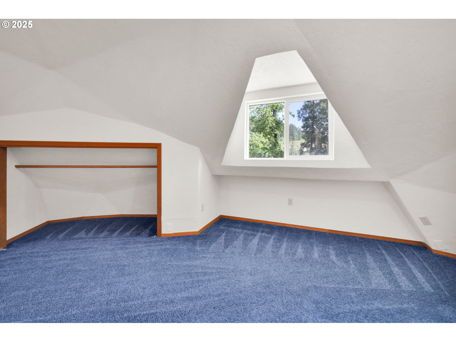 38383 Kickbusch Lane Springfield, OR 97478 - Photo 21 of 44 a view of an empty room with wooden floor and a window