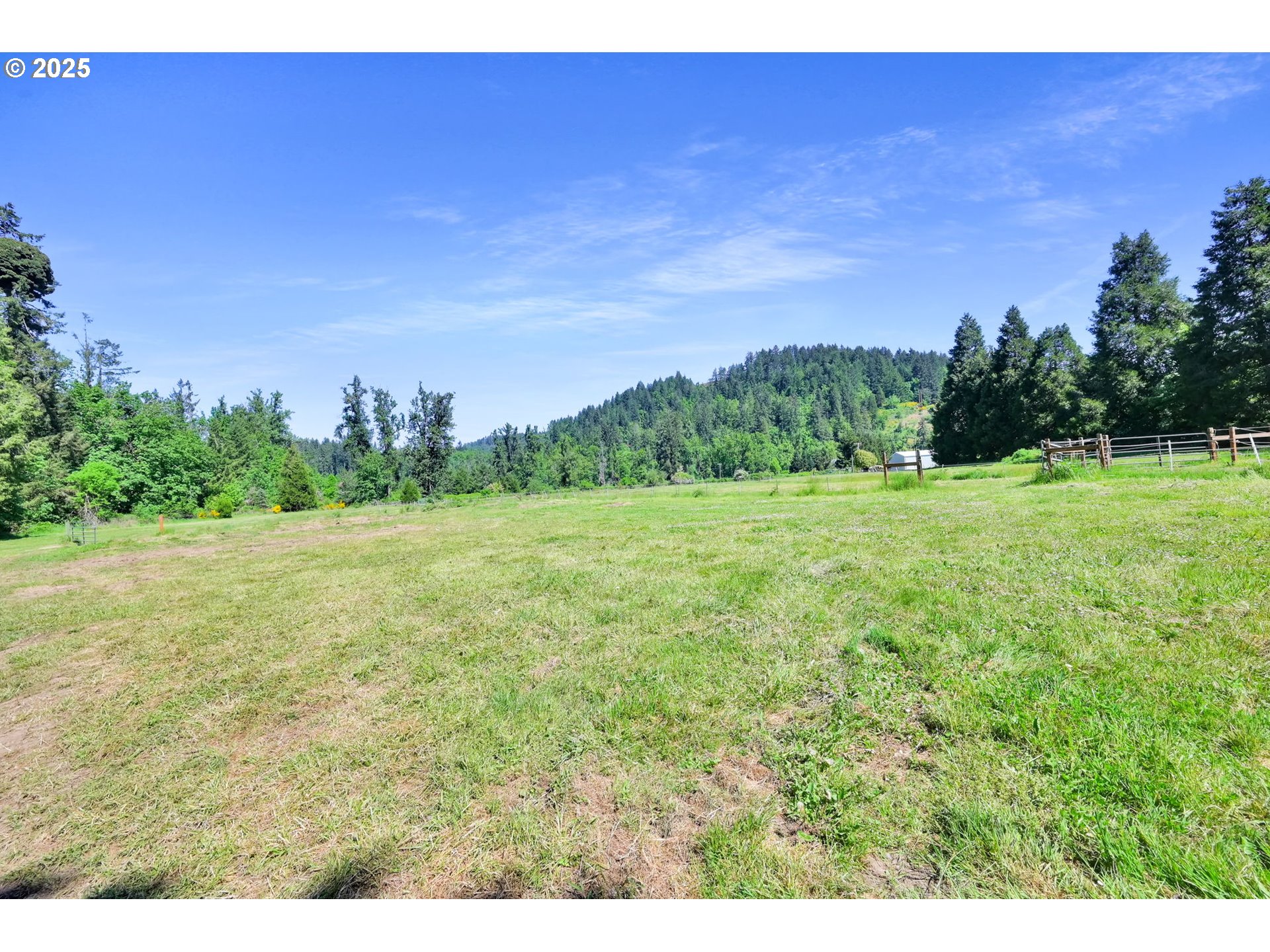 38383 Kickbusch Lane Springfield, OR 97478 - Photo 36 of 44 a view of a big yard with a house in the background