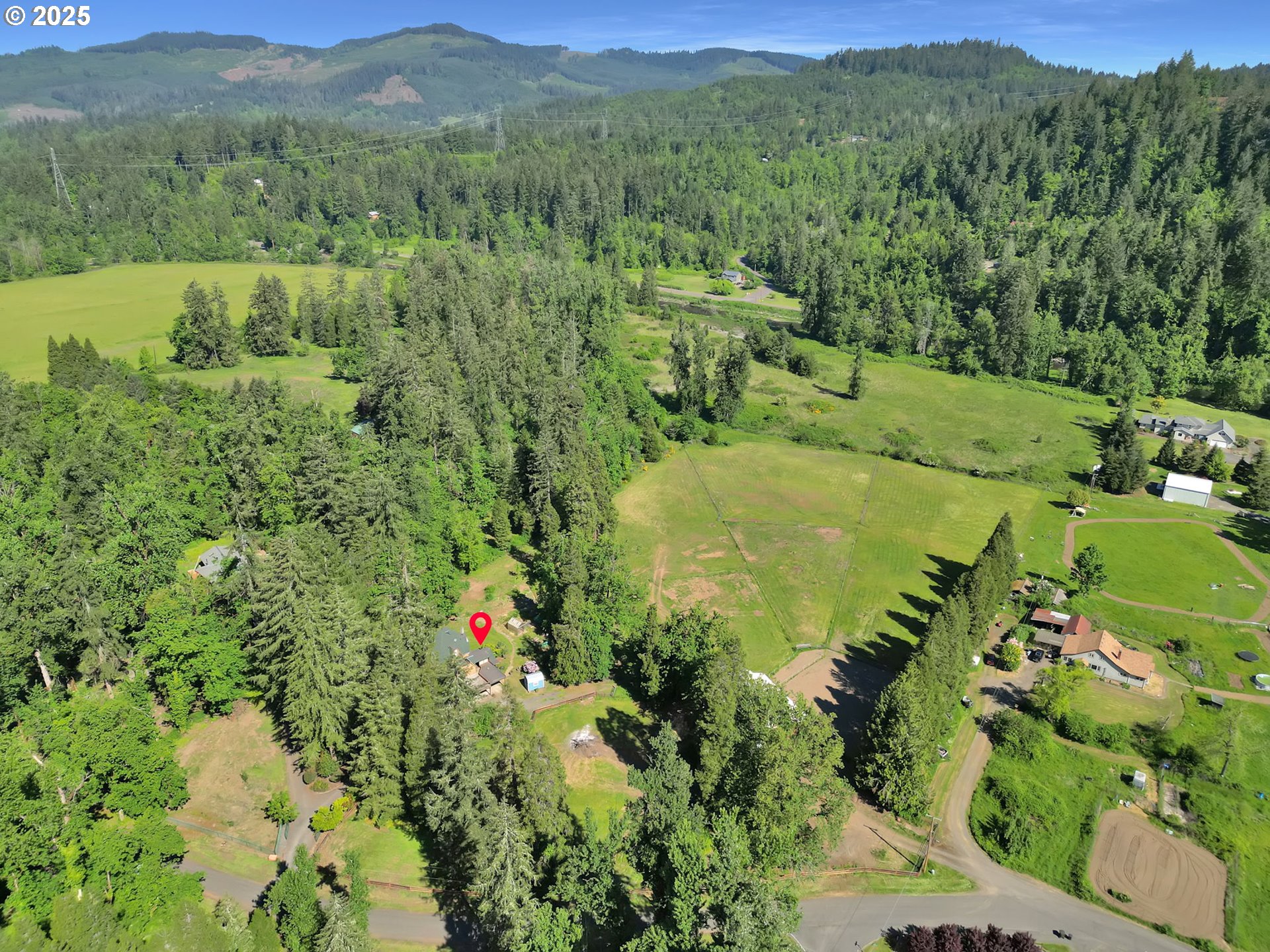 38383 Kickbusch Lane Springfield, OR 97478 - Photo 5 of 44 a view of a lush green hillside and houses