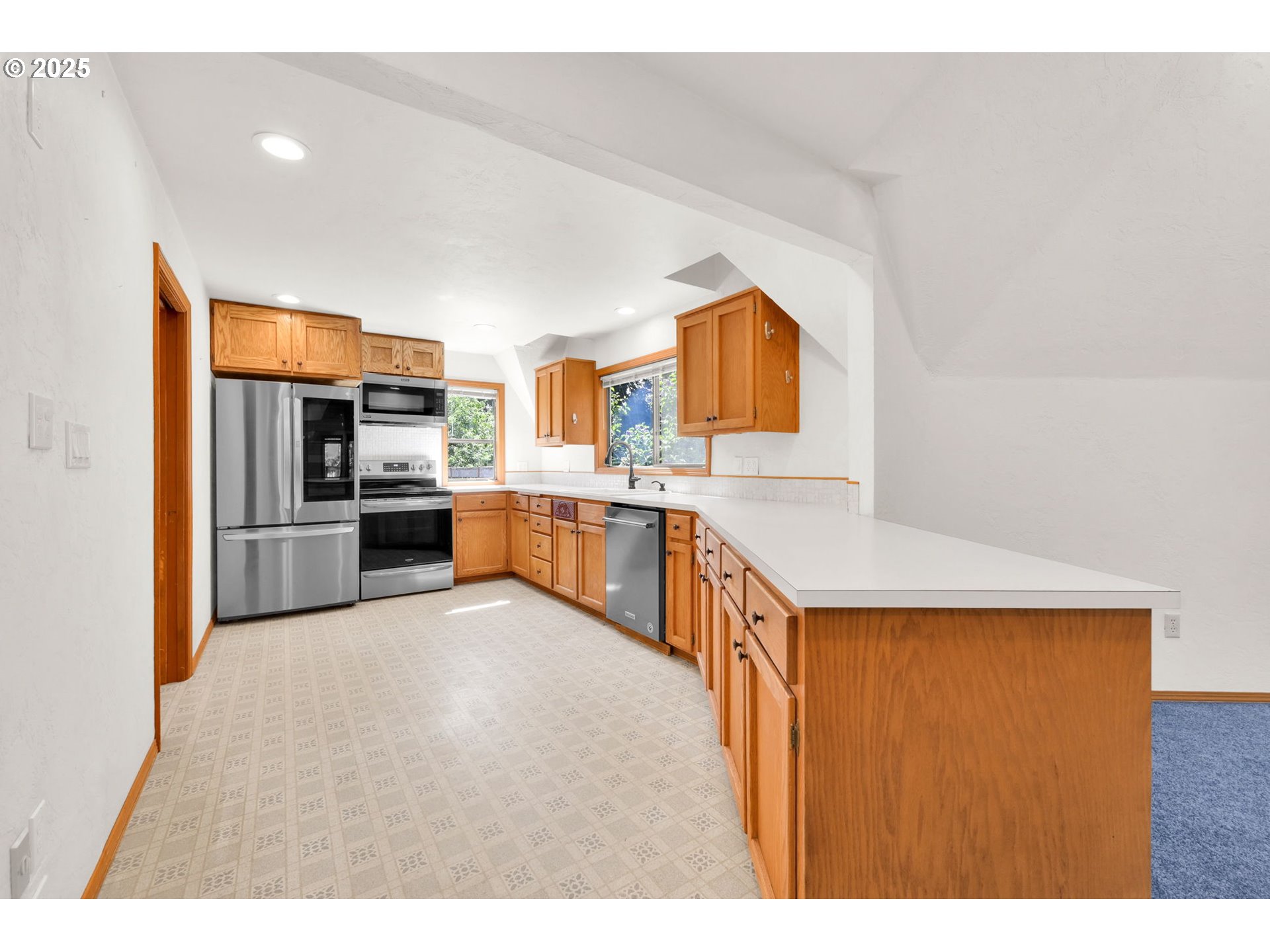 38383 Kickbusch Lane Springfield, OR 97478 - Photo 10 of 44 a kitchen with stainless steel appliances a refrigerator and a sink
