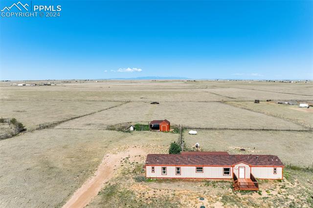 6240 Night Train Lane Yoder, CO 80864 - Photo 5 of 50 Drone / aerial view featuring a rural view