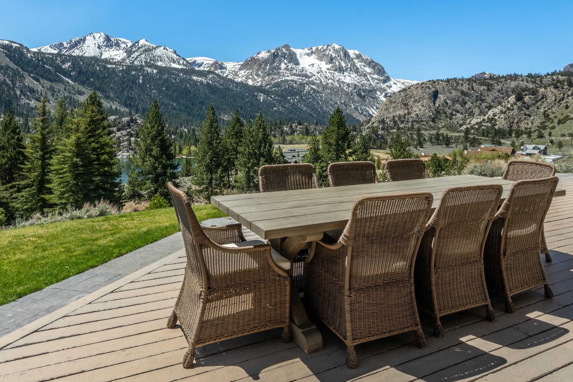 45 Skyline Road June Lake, CA 93529 - Photo 19 of 58 a view of a patio with table and chairs with wooden floor and fence