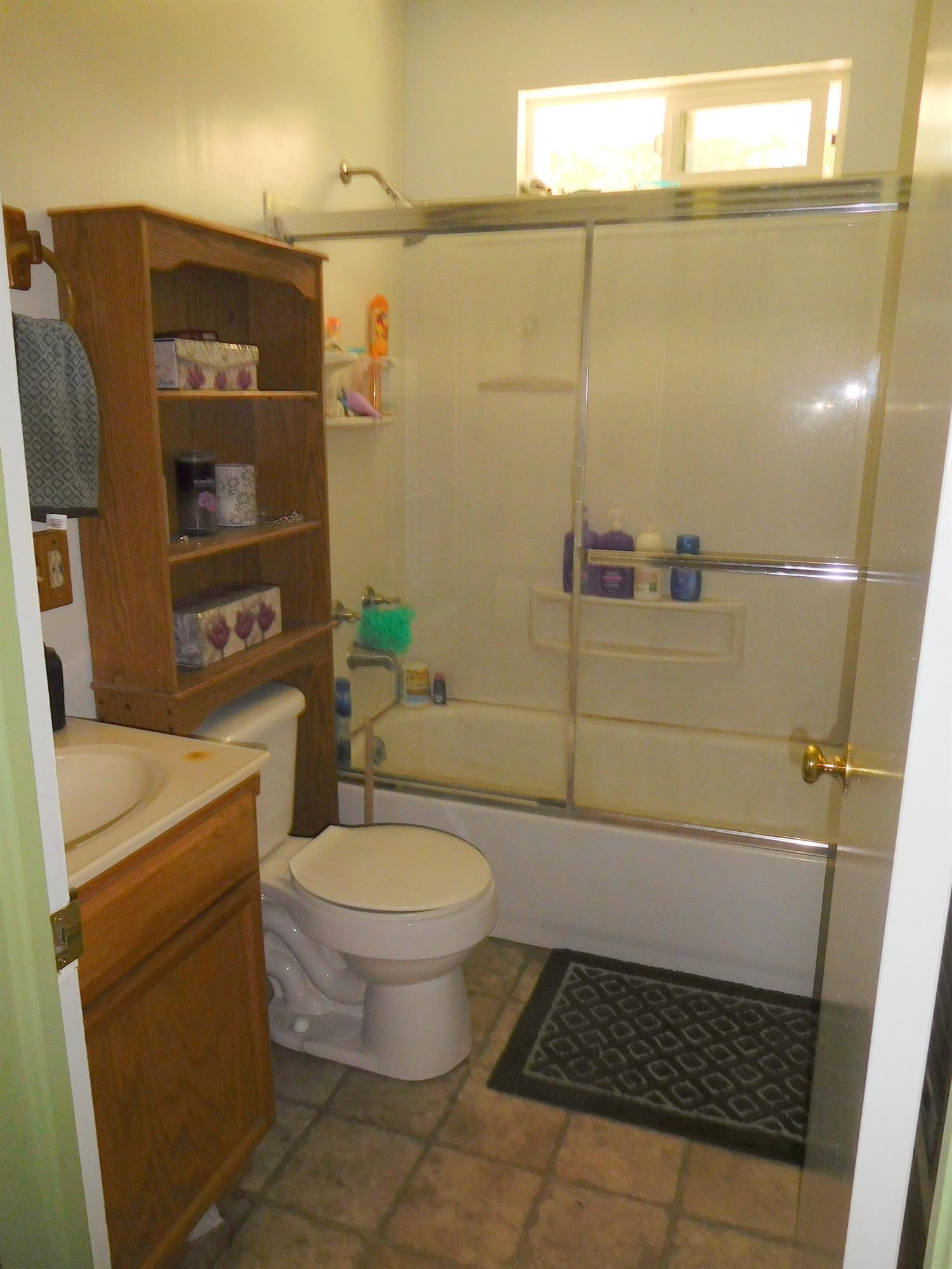 5685 Holland Loop Road Cave Junction, OR 97523 - Photo 14 of 18 One bath in the home, but s very nice tu