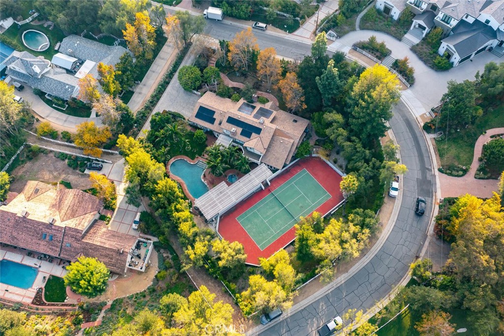 an aerial view of residential house with pool and outdoor space