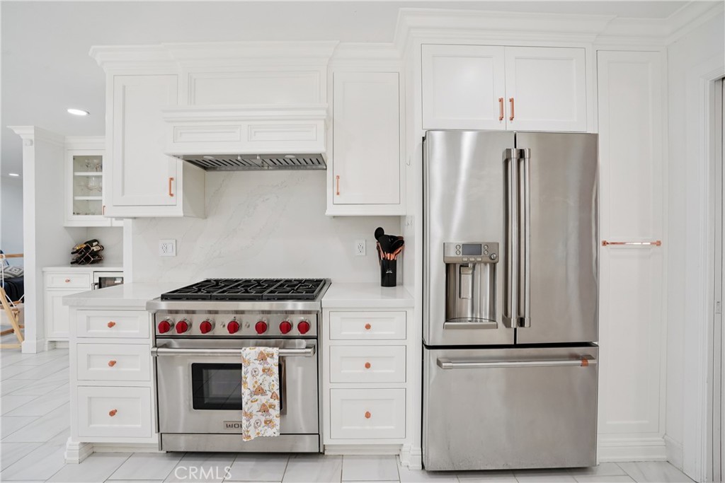 1446 Beechwood Drive Brea, CA 92821 - Photo 14 of 45 a kitchen with stainless steel appliances white cabinets and a refrigerator