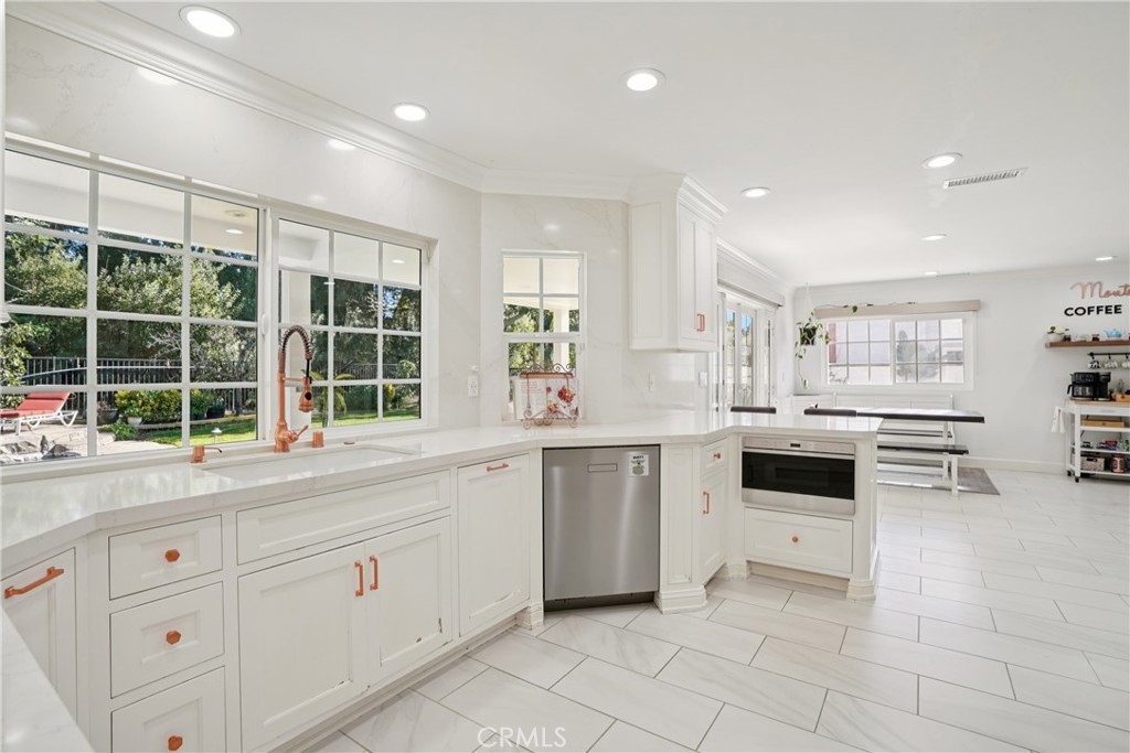 1446 Beechwood Drive Brea, CA 92821 - Photo 15 of 45 a kitchen with granite countertop white cabinets and white appliances