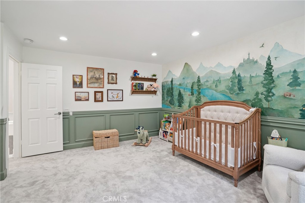 1446 Beechwood Drive Brea, CA 92821 - Photo 18 of 45 a bedroom with a bed and a chandelier