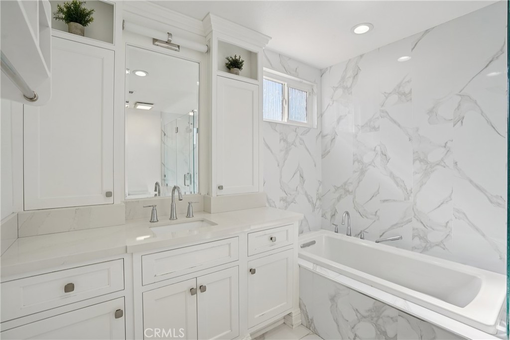 1446 Beechwood Drive Brea, CA 92821 - Photo 31 of 45 a bathroom with a bathtub shower sink vanity and toilet