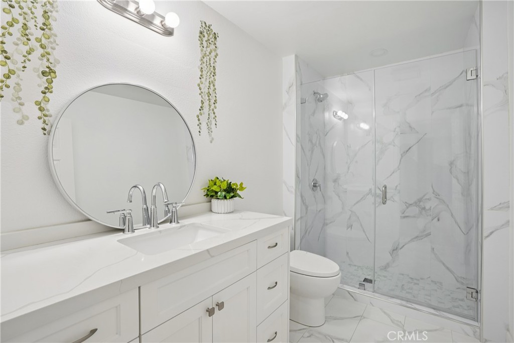 1446 Beechwood Drive Brea, CA 92821 - Photo 32 of 45 a bathroom with a granite countertop sink a toilet and shower