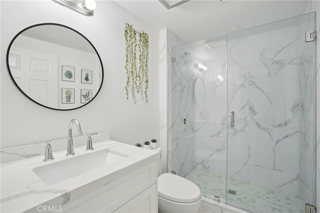 1446 Beechwood Drive Brea, CA 92821 - Photo 33 of 45 a bathroom with a sink a toilet and a mirror