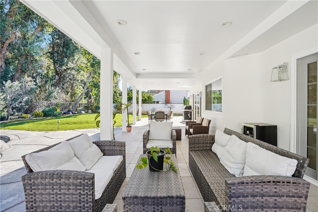 1446 Beechwood Drive Brea, CA 92821 - Photo 38 of 45 a living room with furniture floor to ceiling window and a table