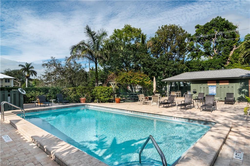 1295 Solana Road, Unit C5 Naples, FL 34103 - Photo 13 of 13 a view of a swimming pool with a patio
