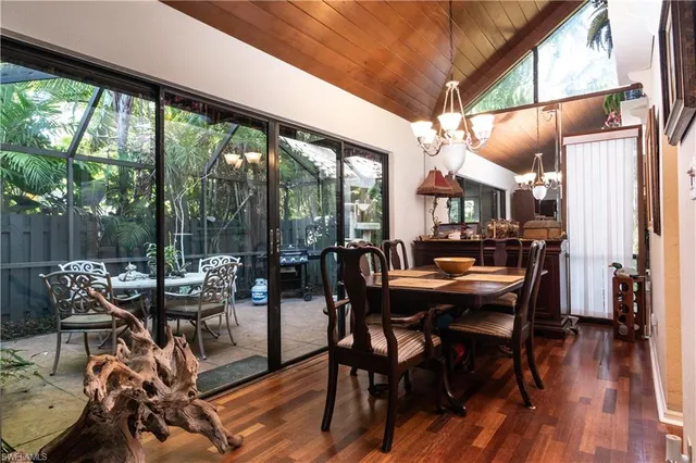 a dining room with furniture and wooden floor
