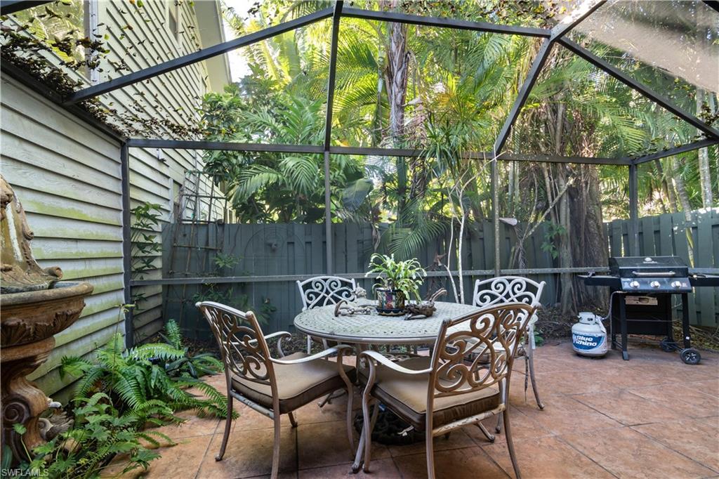 1295 Solana Road, Unit C5 Naples, FL 34103 - Photo 5 of 13 a view of chair and tables