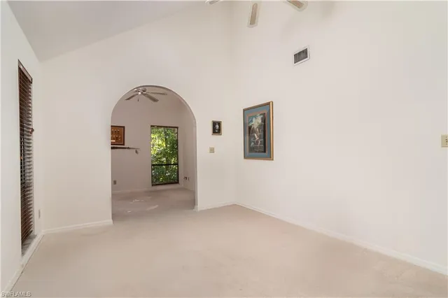 a bathroom with a sink a toilet a mirror and shower