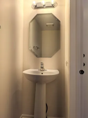 a bathroom with a sink and mirror