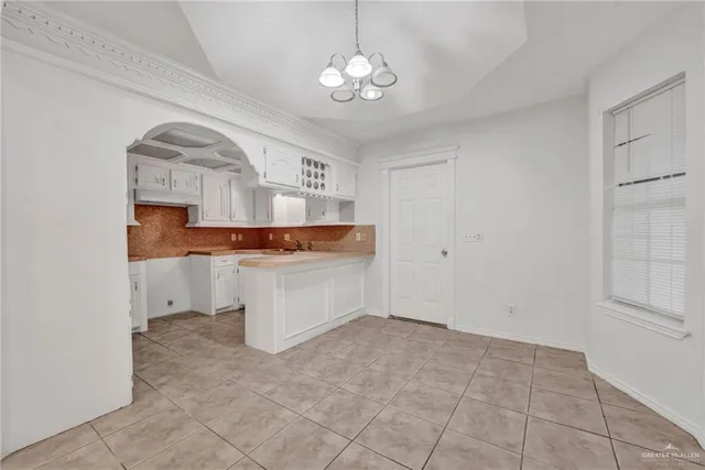 a view of kitchen with center island and stainless steel appliances